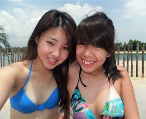 Little Japanese girlfriends on the beach