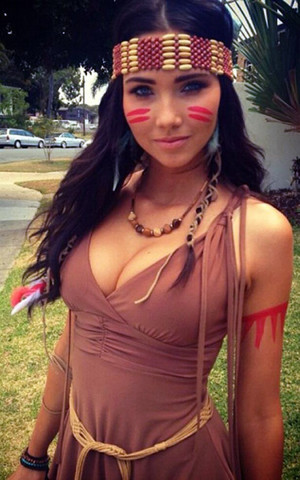 Young pretty woman dressed as an Indian.